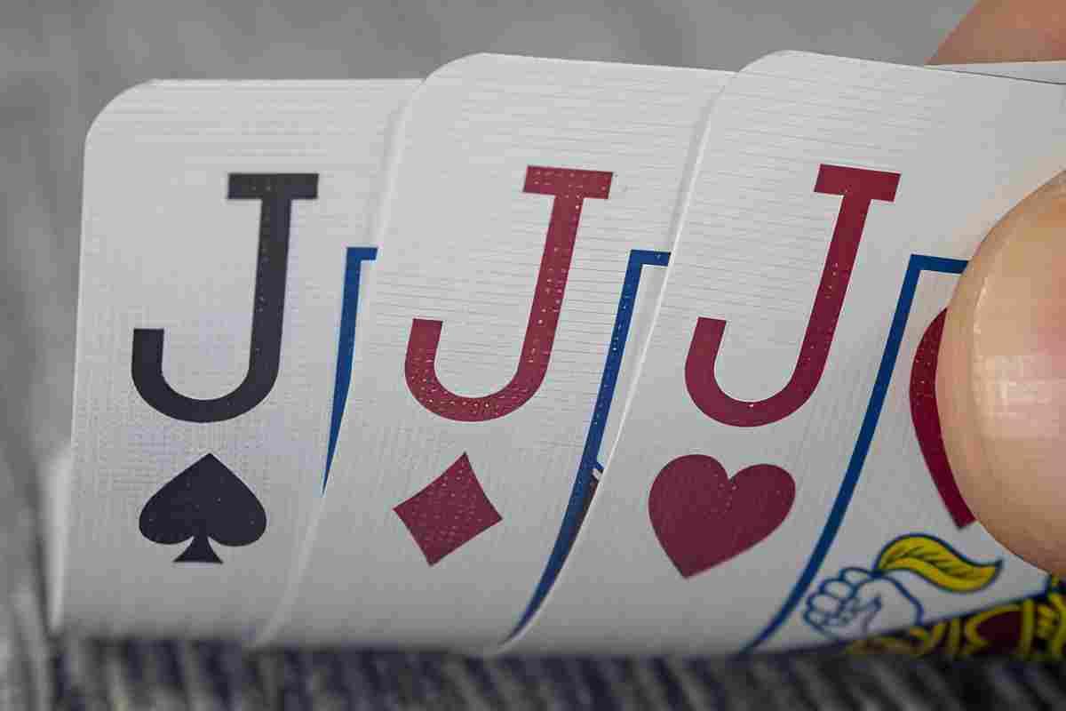 A poker game in action with a pair of threes visible.