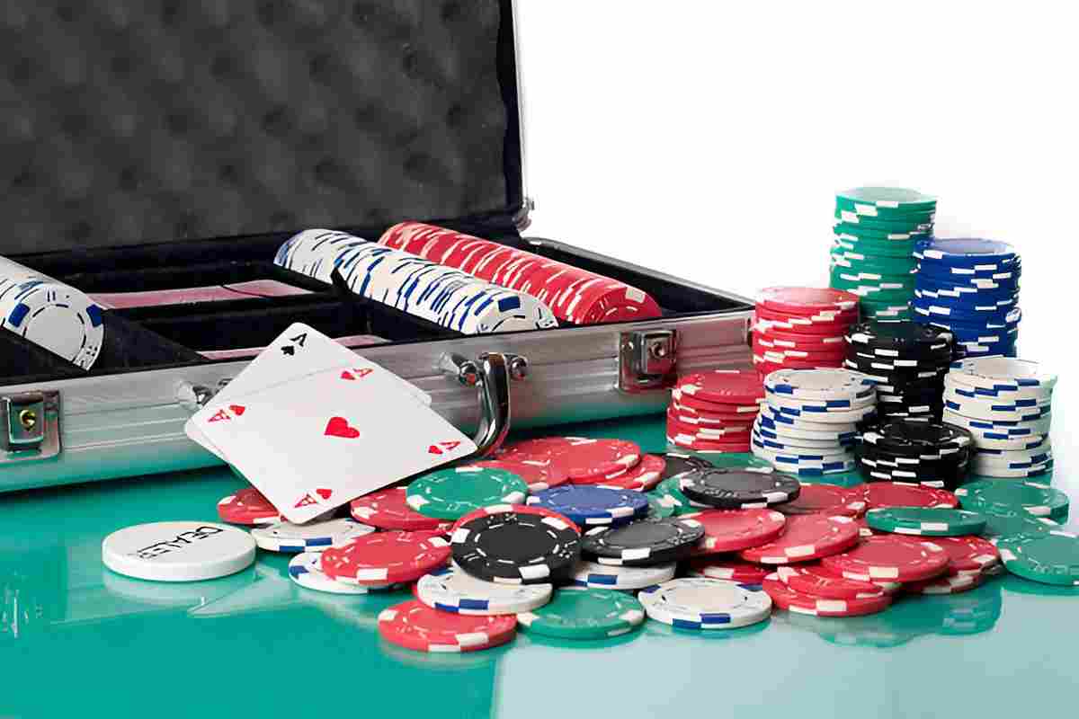 A complete poker chip set with multiple colored chips and playing cards.